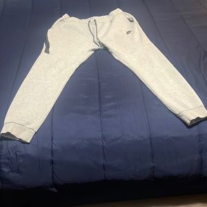 100% real Nike tech pants if dry cleaned like brand new few stains not visible